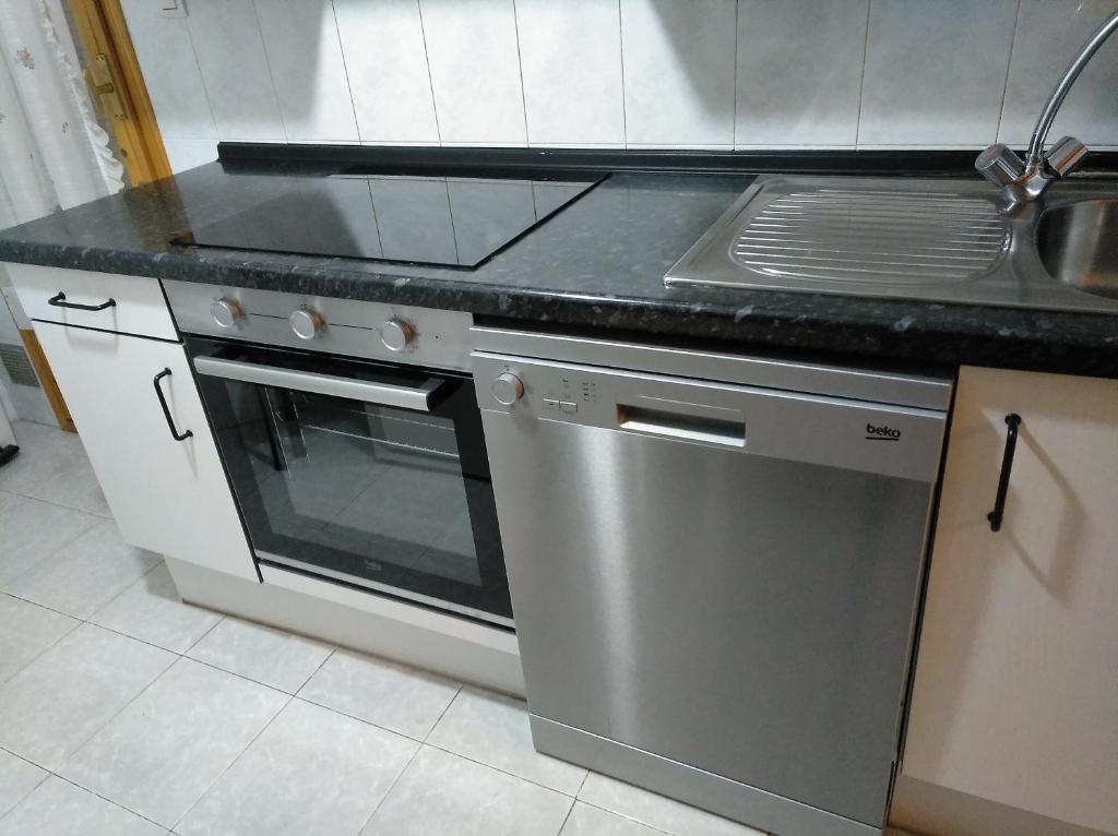 Kuchyň nebo kuchyňský kout v ubytování Best Biescas Tourist Home