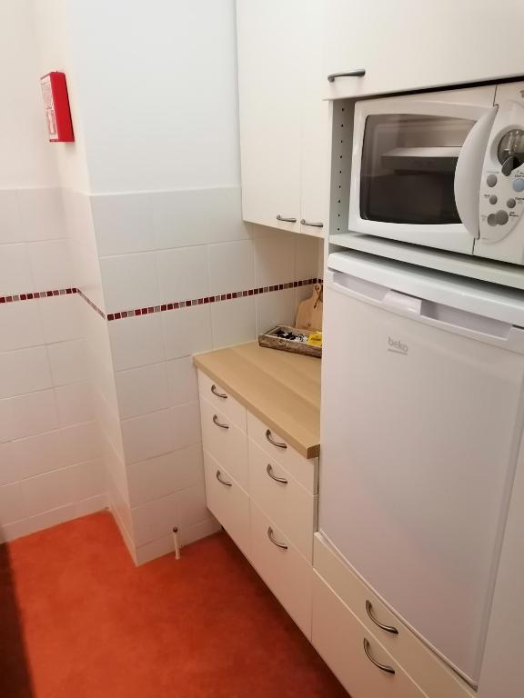 Kuchyň nebo kuchyňský kout v ubytování studio oostende aan zee