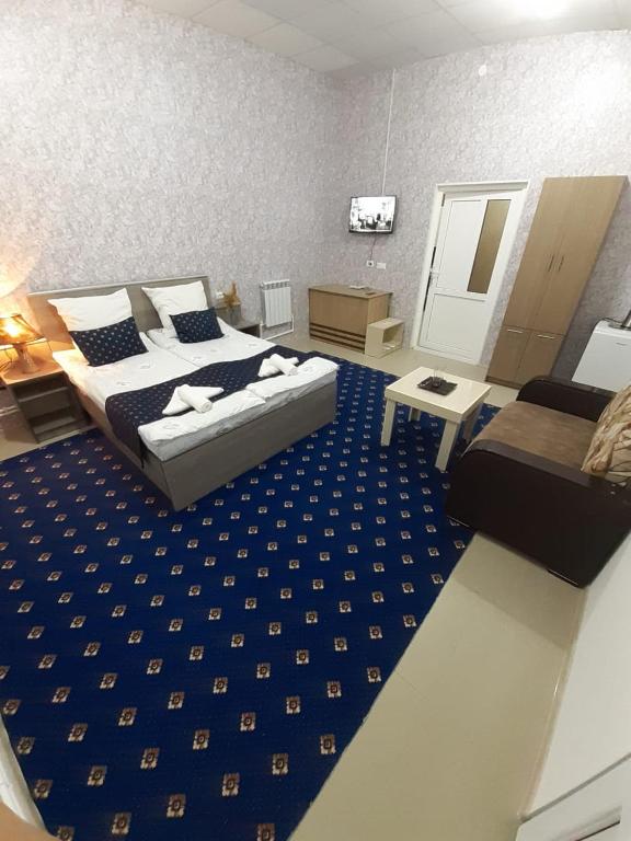 Postel nebo postele na pokoji v ubytování Lind Hotel and Guest House