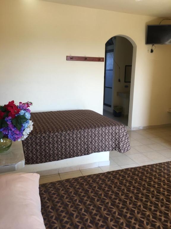 Postel nebo postele na pokoji v ubytování Hotel Sociedad y Maristas