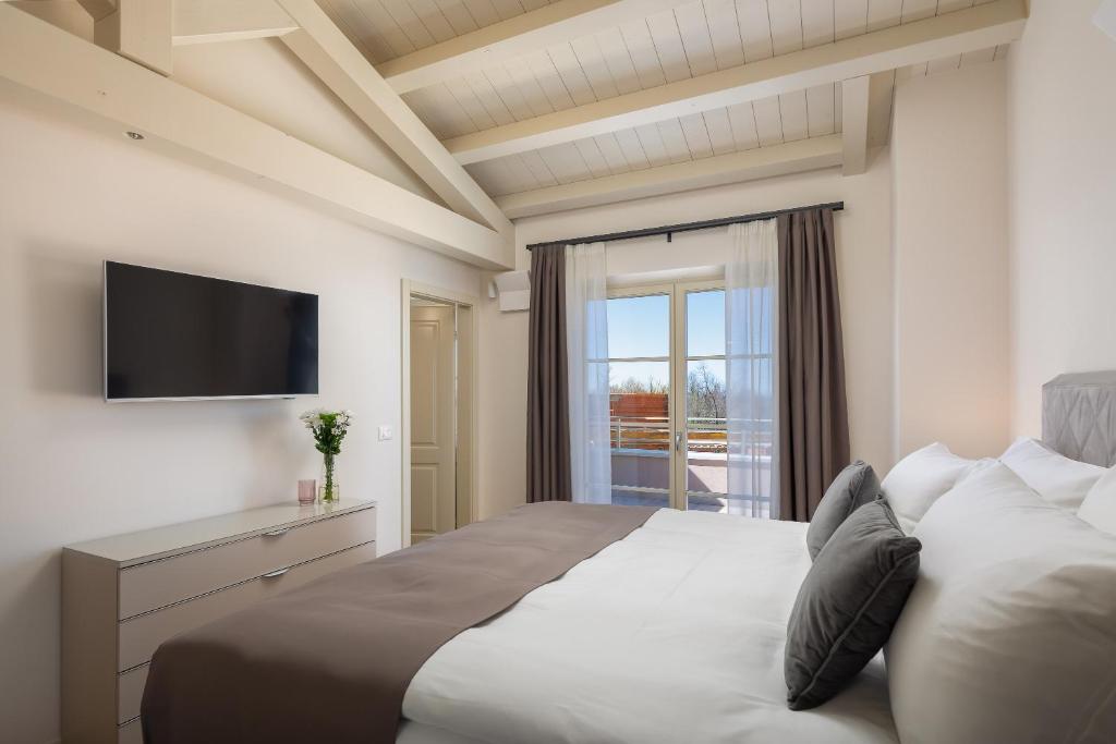 Ein Bett oder Betten in einem Zimmer der Unterkunft Villa Grace by ILC (Istria Luxury Collection)