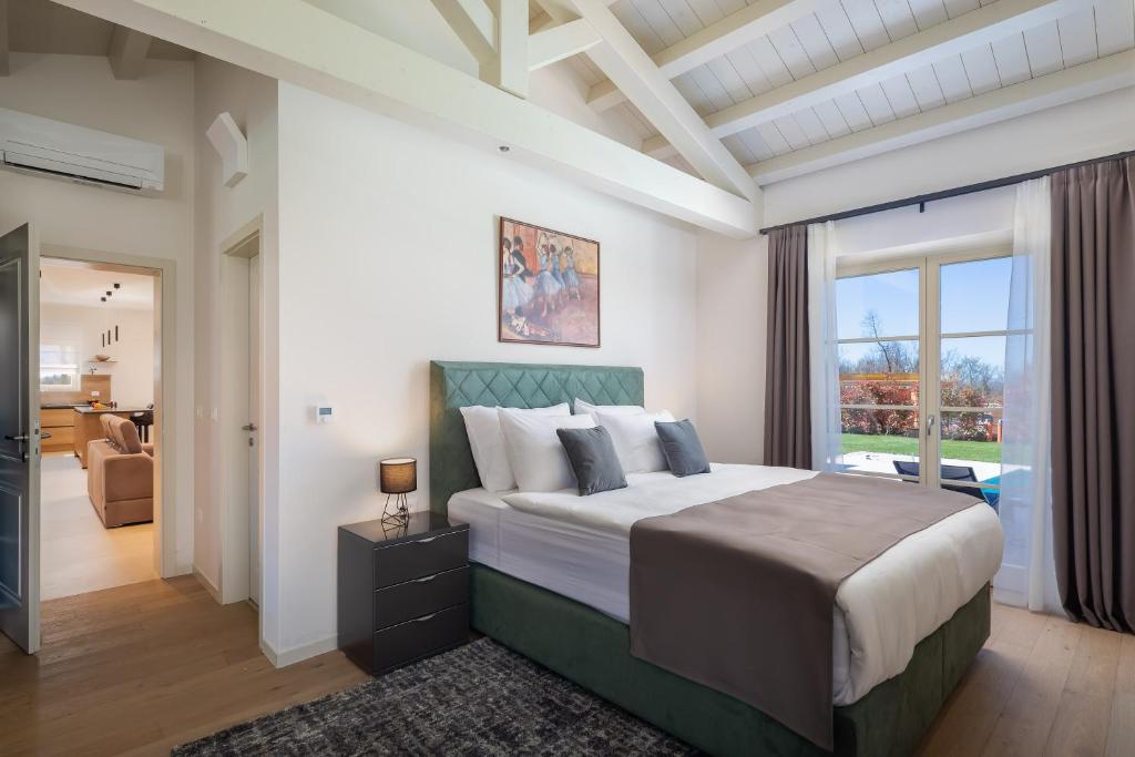 Ein Bett oder Betten in einem Zimmer der Unterkunft Villa Grace by ILC (Istria Luxury Collection)