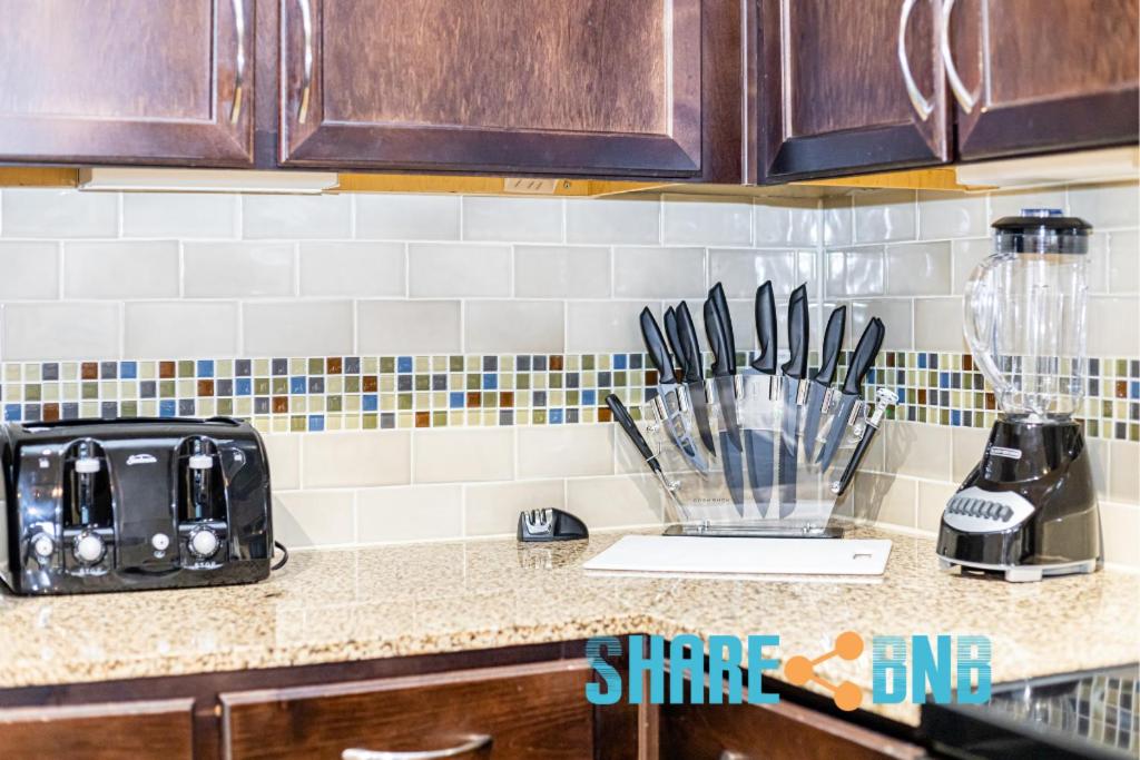 a kitchen counter with a blender and utensils at Charming Dallas Getaway W Modern Amenities in Dallas