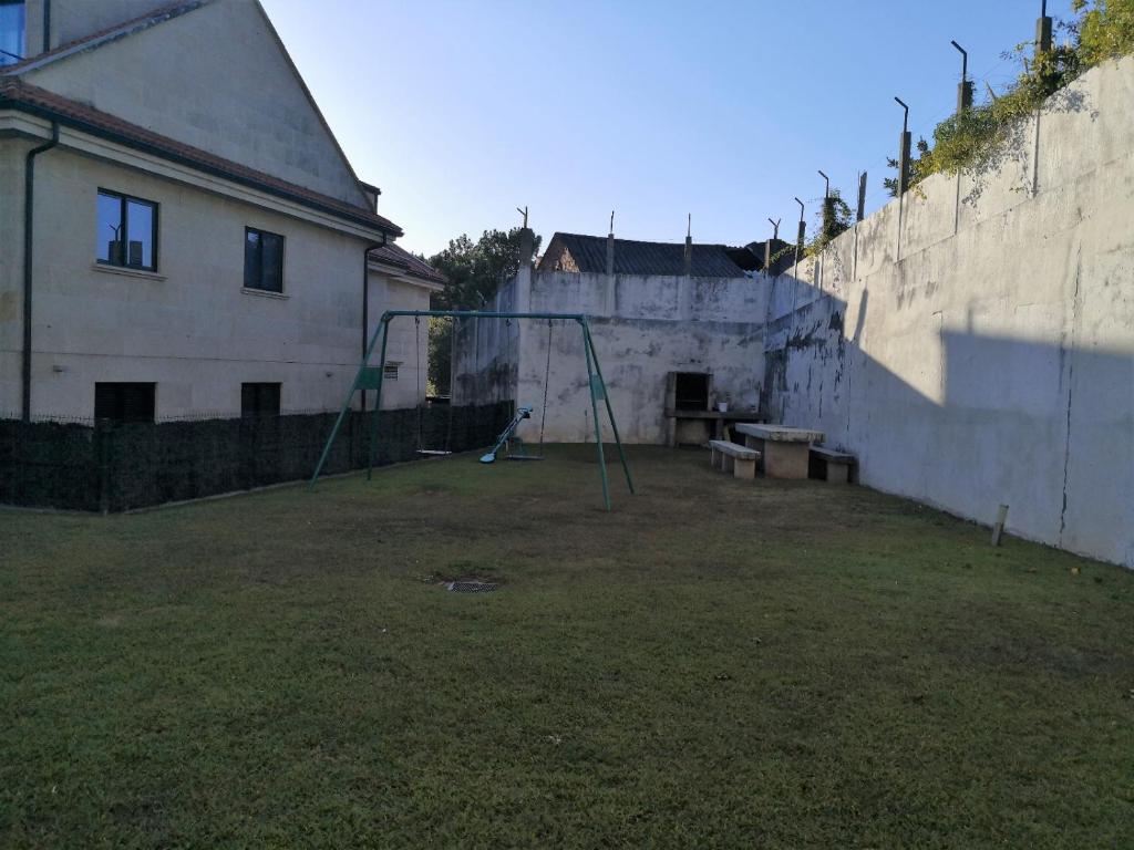 Vonkajšia záhrada v ubytovaní Apartamento con terraza y piscina
