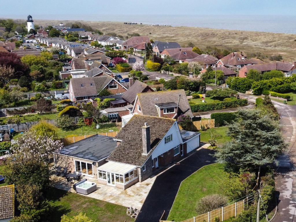 an aerial view of a home with a lighthouse at Fallowfield in Great Yarmouth