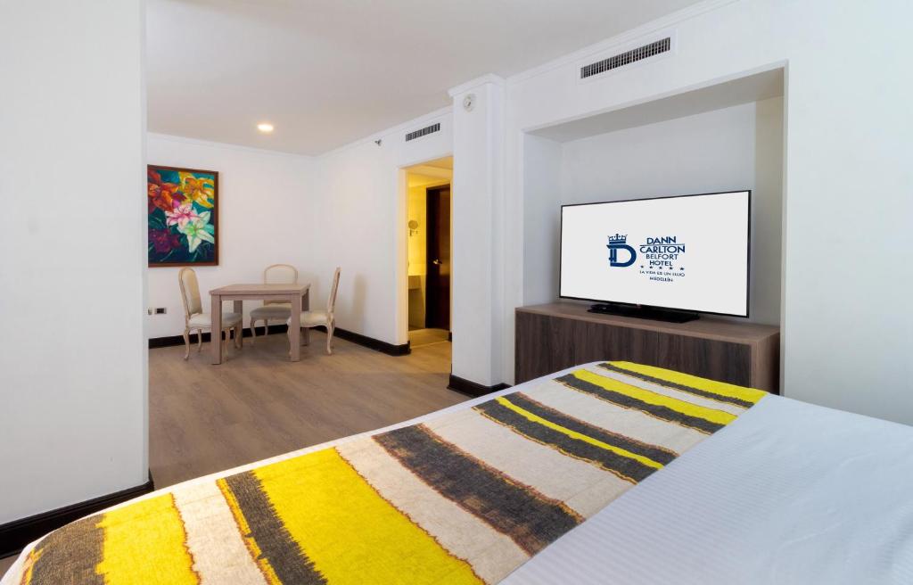 Postel nebo postele na pokoji v ubytování Hotel Dann Carlton Belfort Medellin
