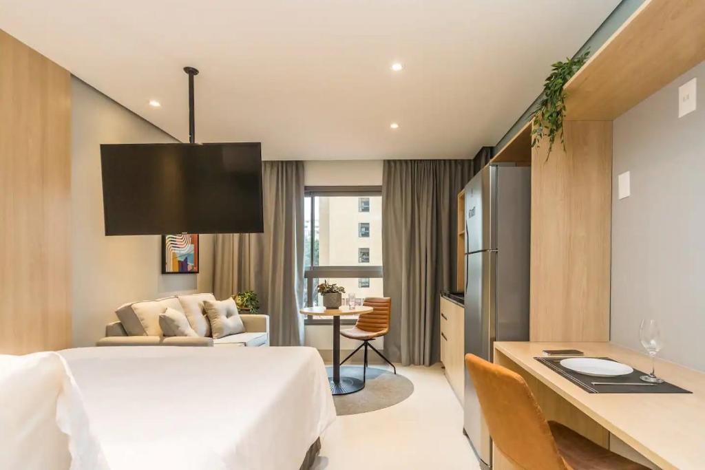 Postel nebo postele na pokoji v ubytování Cozzy Suites Paraíso Hotel