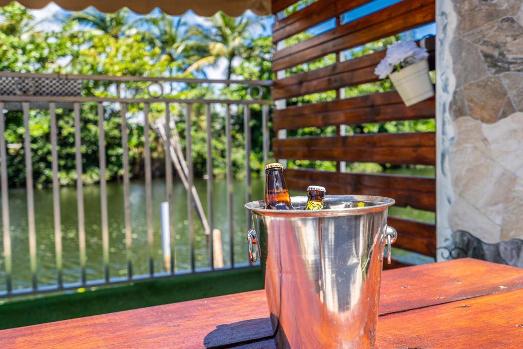 two bottles of beer in a bucket on a table at romantic place by the river in Miami