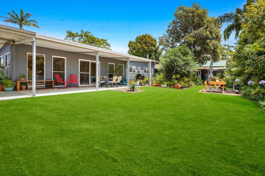 a large yard in front of a house at Sojourne in Shoalhaven Heads