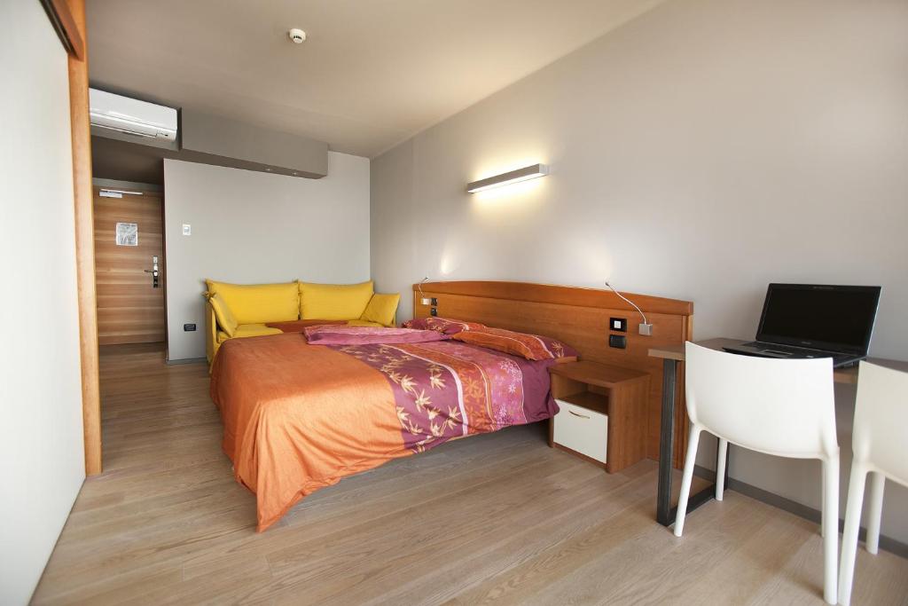 Postel nebo postele na pokoji v ubytování Ambienthotel Spiaggia