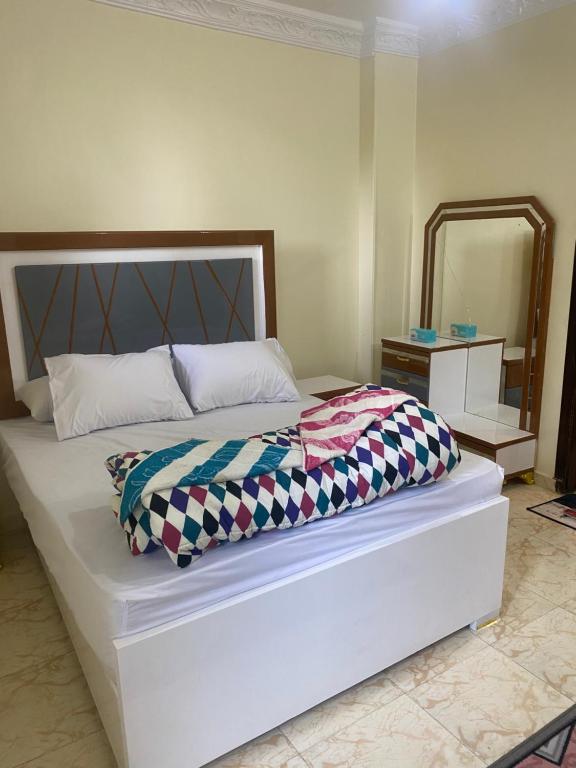 Postel nebo postele na pokoji v ubytování Sunrise shiny Nubian Guest House