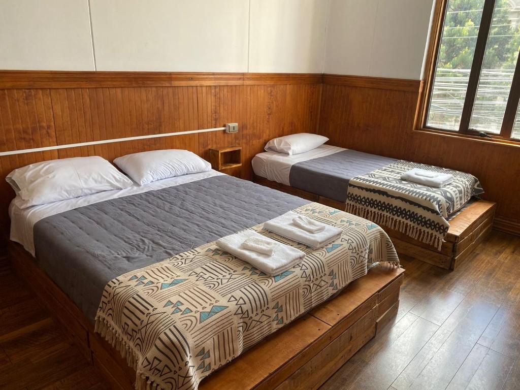Postel nebo postele na pokoji v ubytování Hostal Ochen