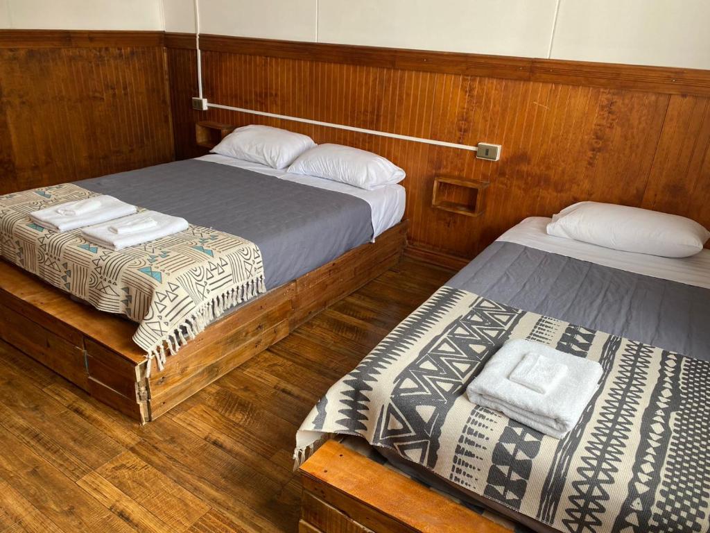 Postel nebo postele na pokoji v ubytování Hostal Ochen