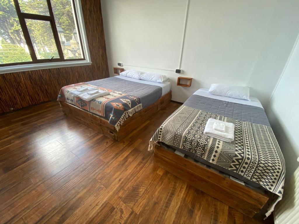 Postel nebo postele na pokoji v ubytování Hostal Ochen