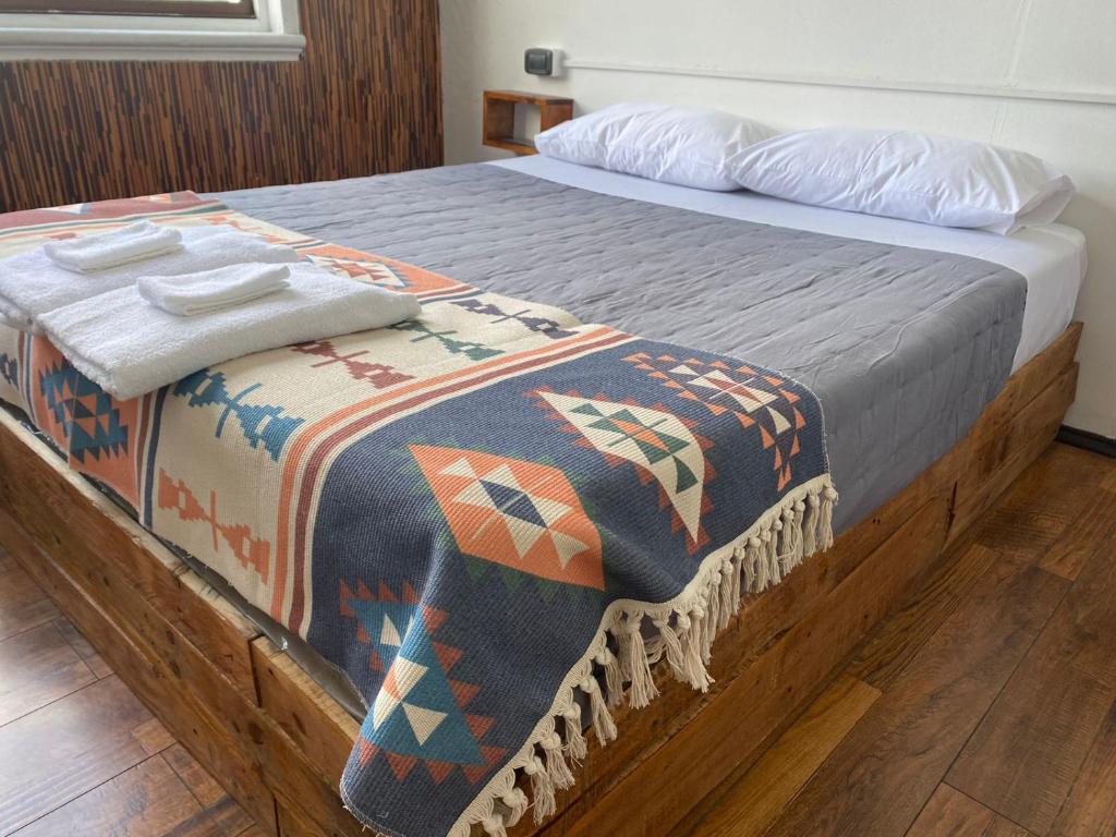 Postel nebo postele na pokoji v ubytování Hostal Ochen