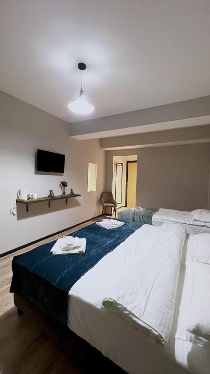 Postel nebo postele na pokoji v ubytování GABATA INN