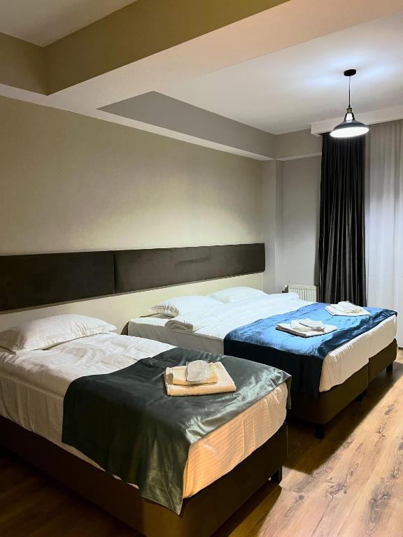 Postel nebo postele na pokoji v ubytování GABATA INN