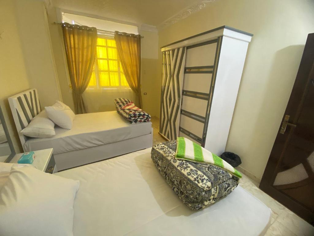 Postel nebo postele na pokoji v ubytování Sunrise shiny Nubian Guest House