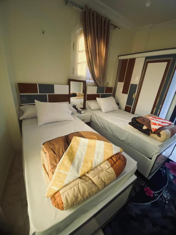 Postel nebo postele na pokoji v ubytování Sunrise shiny Nubian Guest House