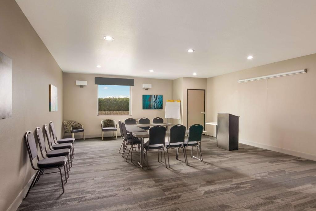 a conference room with a table and chairs and a podium at Best Western Plus Killeen - Fort Cavazos Hotel & Suites in Killeen