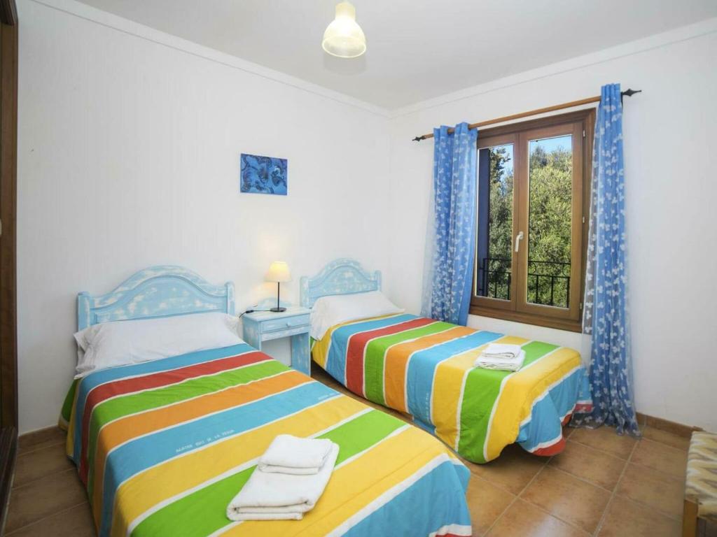 Postel nebo postele na pokoji v ubytování Villa in Muro near Can Picafort Beach