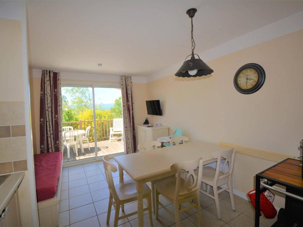 a kitchen and dining room with a table and chairs at Maison 6 pers. avec Terrasse Privée, 3 Pièces en Duplex – Wifi & Animaux Admis - FR-1-382-119 in Grospierres