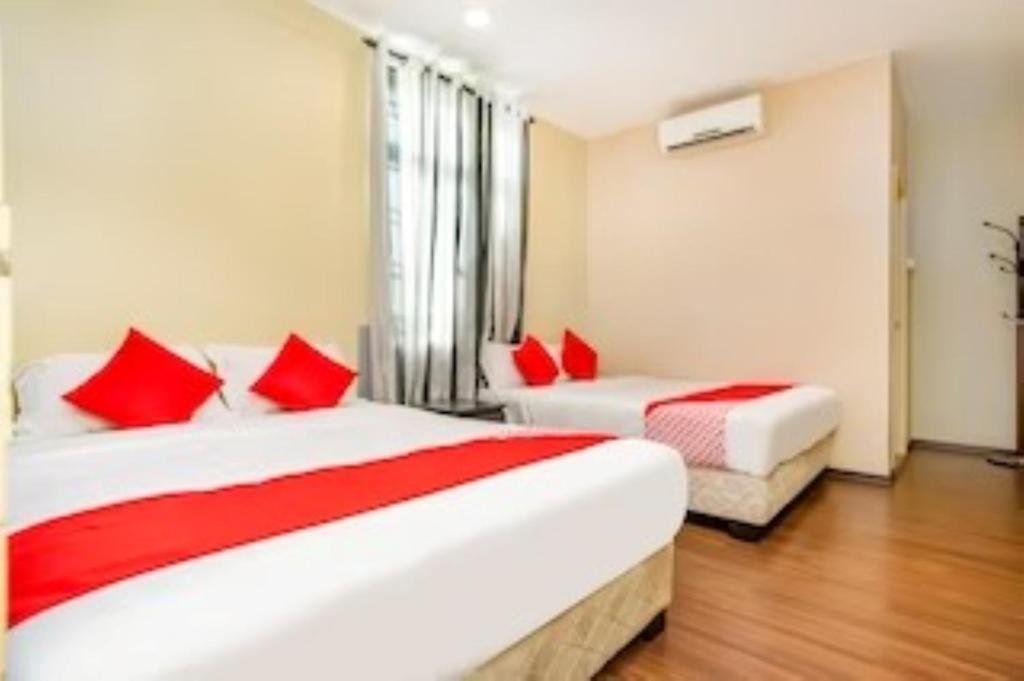 Postel nebo postele na pokoji v ubytování D'Pinetrees Hotel