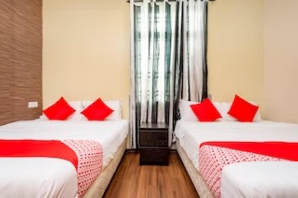 Postel nebo postele na pokoji v ubytování D'Pinetrees Hotel