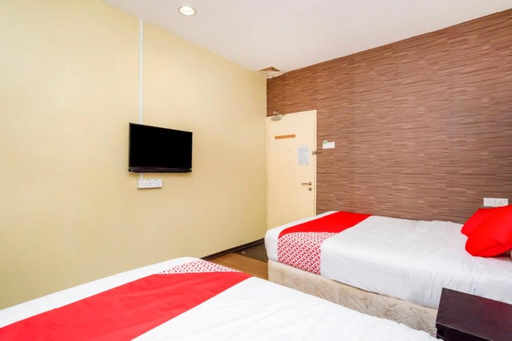 Postel nebo postele na pokoji v ubytování D'Pinetrees Hotel