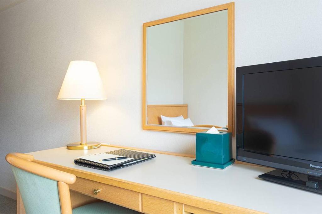 TV a/nebo společenská místnost v ubytování The Saihokukan Hotel