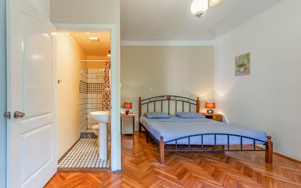 Postel nebo postele na pokoji v ubytování Liznjan - Blue Gate Manor