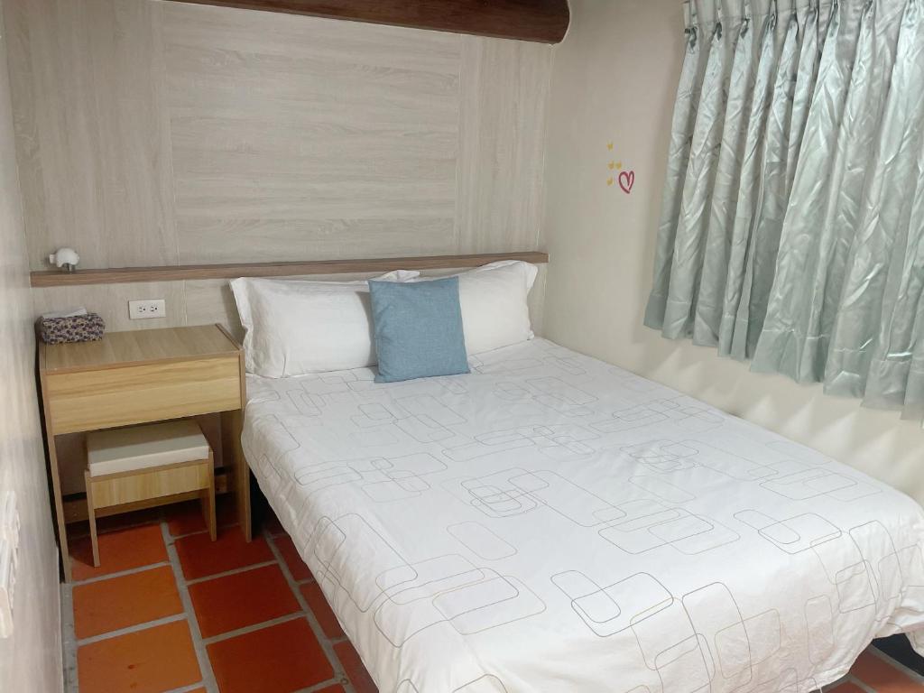 Postel nebo postele na pokoji v ubytování Xinqin B&B - City Area