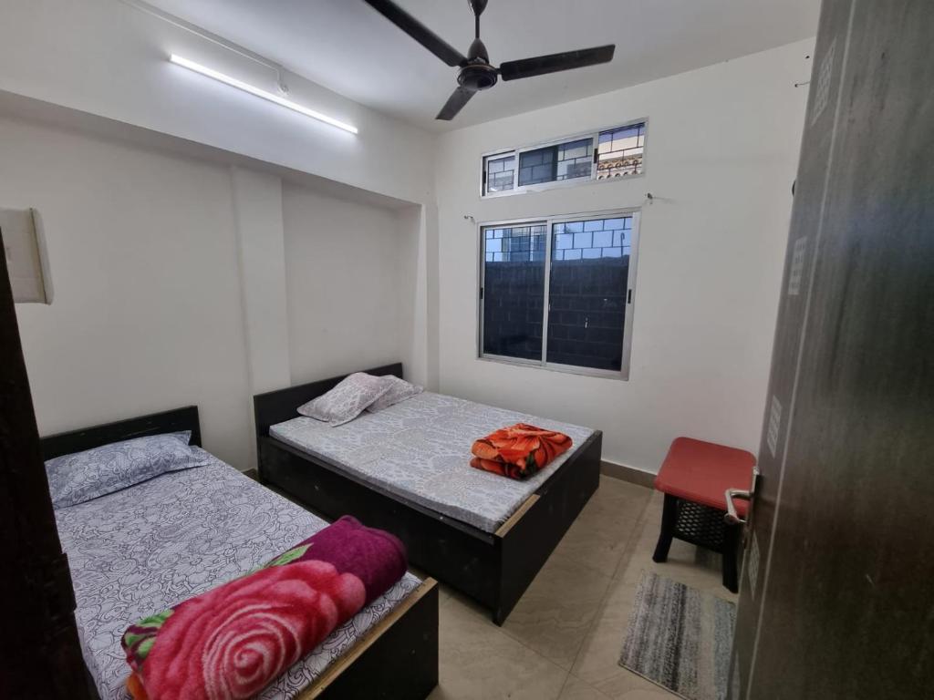 Кровать или кровати в номере The Economy Guesthouse