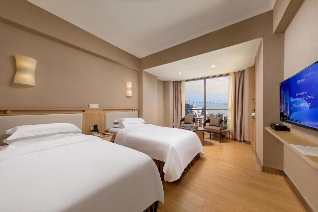 TV a/nebo společenská místnost v ubytování Guangdong Hotel (Zhuhai)