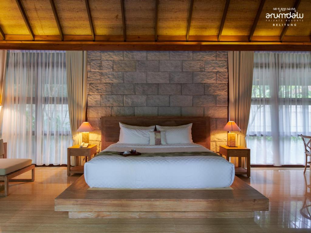 Postel nebo postele na pokoji v ubytování Arumdalu Private Resort