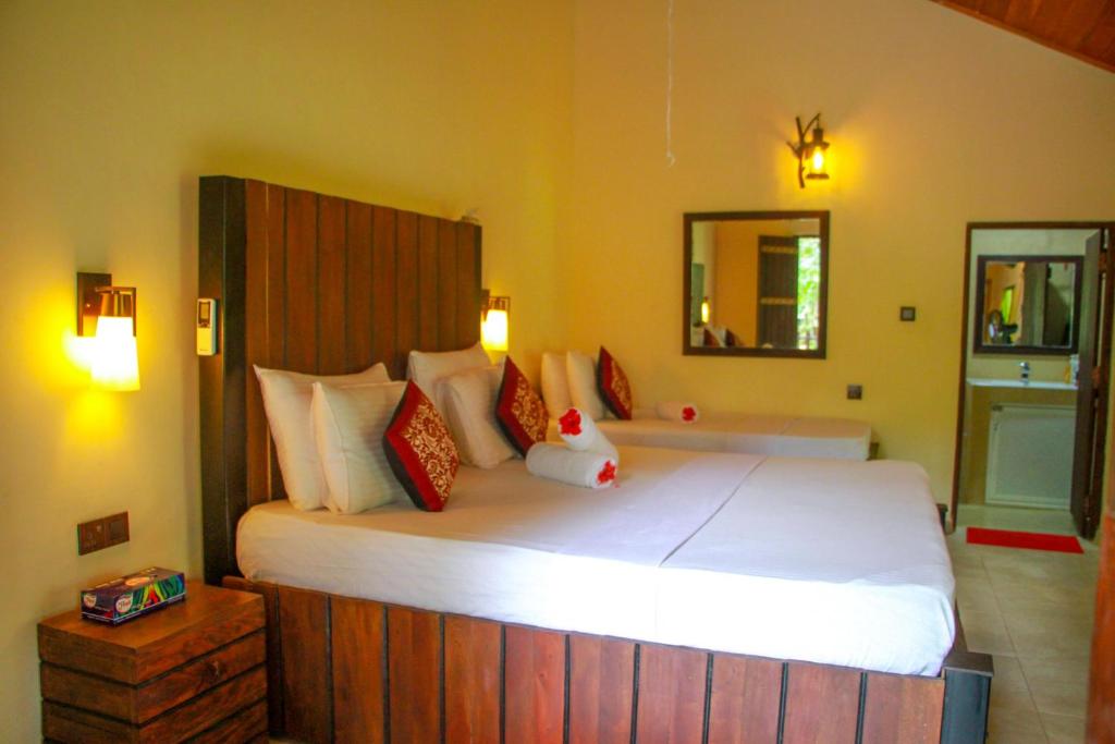 Postel nebo postele na pokoji v ubytování Machcha Lodge Sigiriya