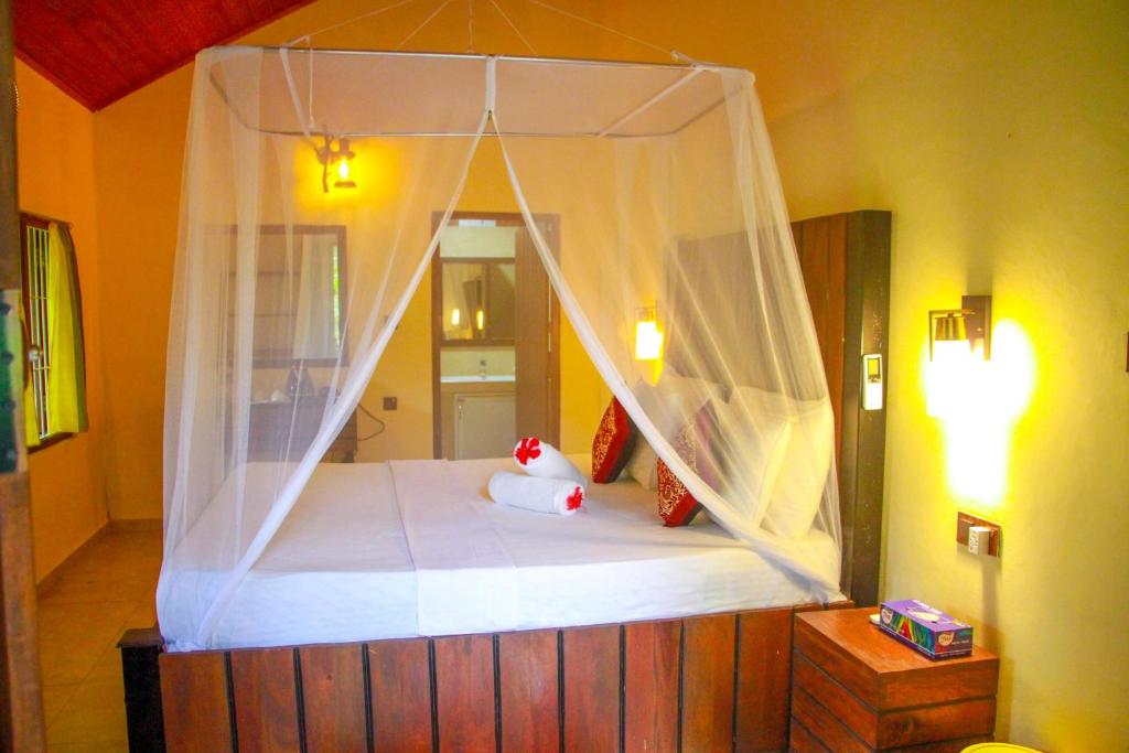 Postel nebo postele na pokoji v ubytování Machcha Lodge Sigiriya