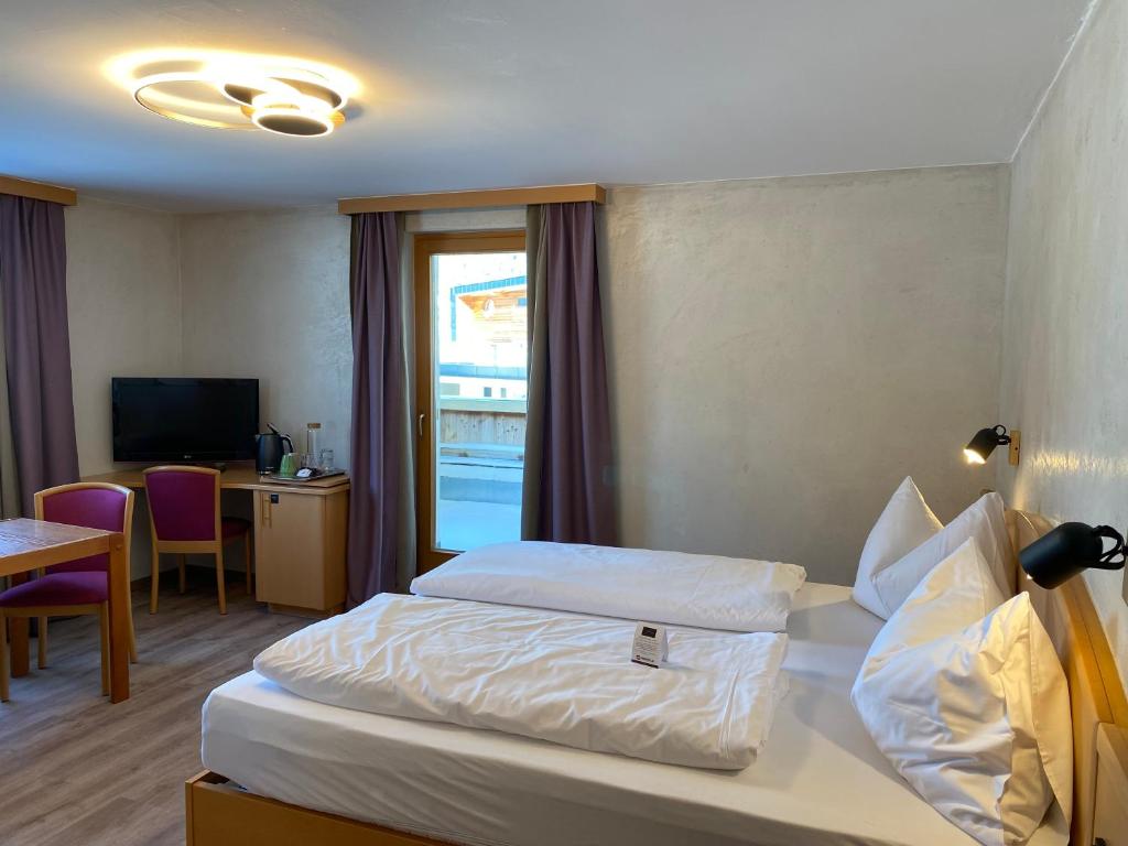 Postel nebo postele na pokoji v ubytování Hotel Acherl