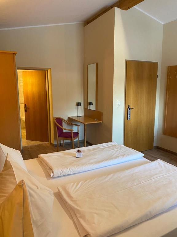 Postel nebo postele na pokoji v ubytování Hotel Acherl