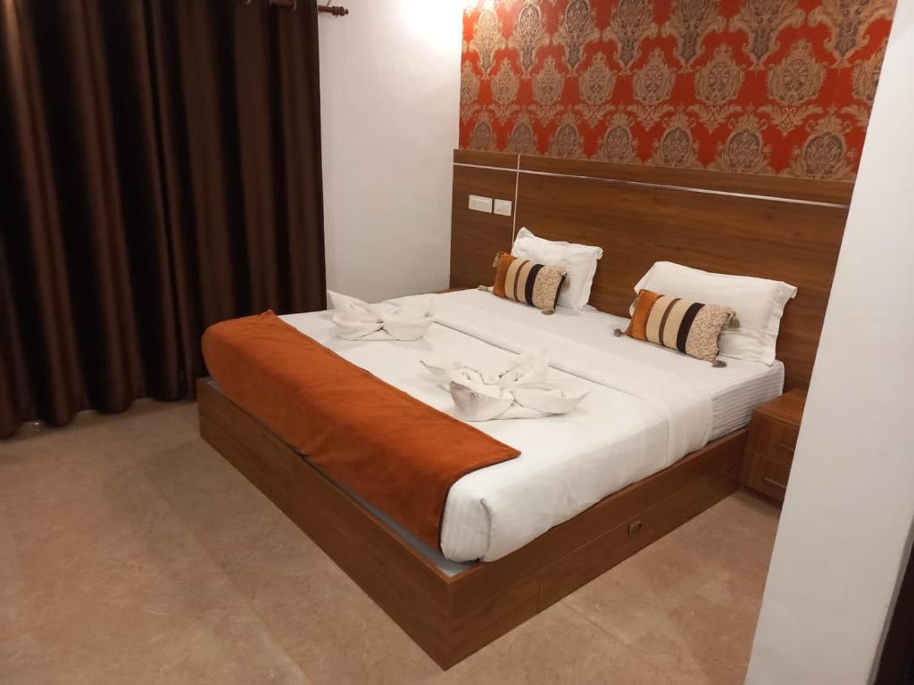 Postel nebo postele na pokoji v ubytování Fortkochi Beach Inn