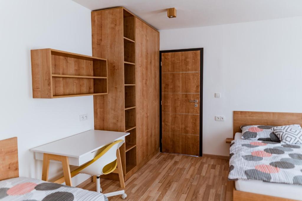 Postel nebo postele na pokoji v ubytování Apartmány Jabloneček