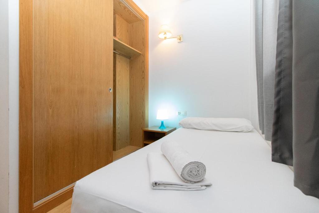 Voodi või voodid majutusasutuse Apartamentos Canillo 3000 toas