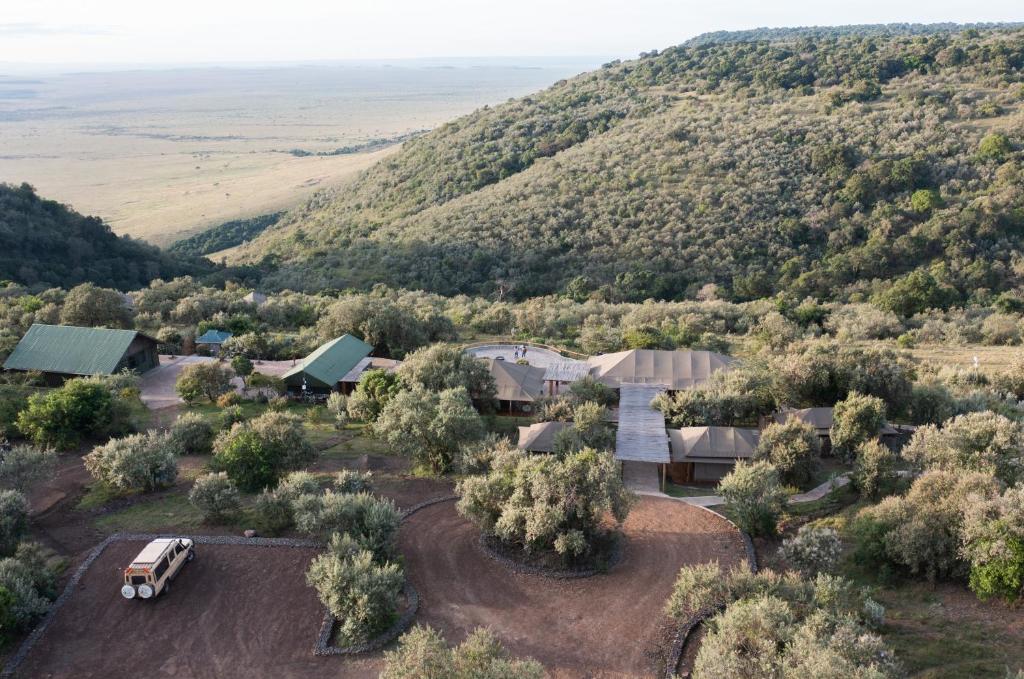 an aerial view of a farm with a truck parked in a field at Mara Elatia Camp in Masai Mara