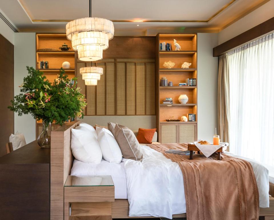 Postel nebo postele na pokoji v ubytování Cape Nidhra Hotel
