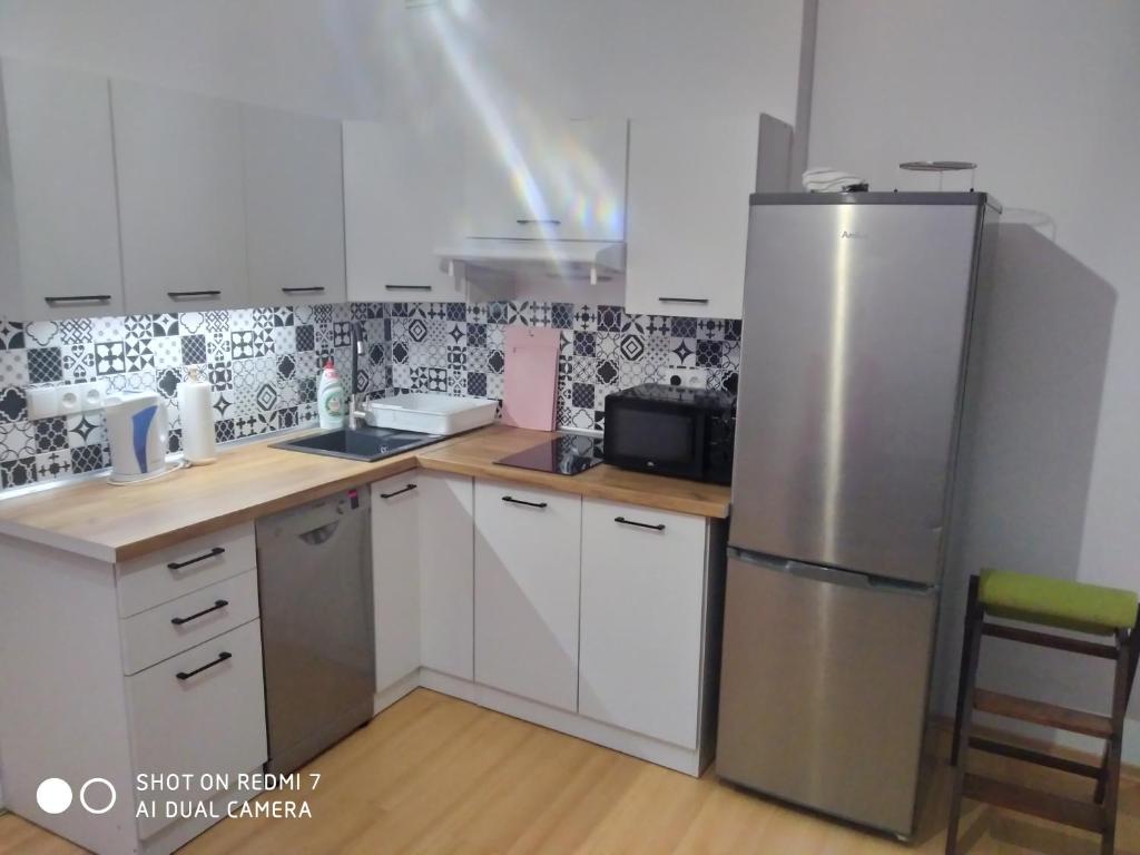 Kuchyňa alebo kuchynka v ubytovaní Apartament przy Słonecznej