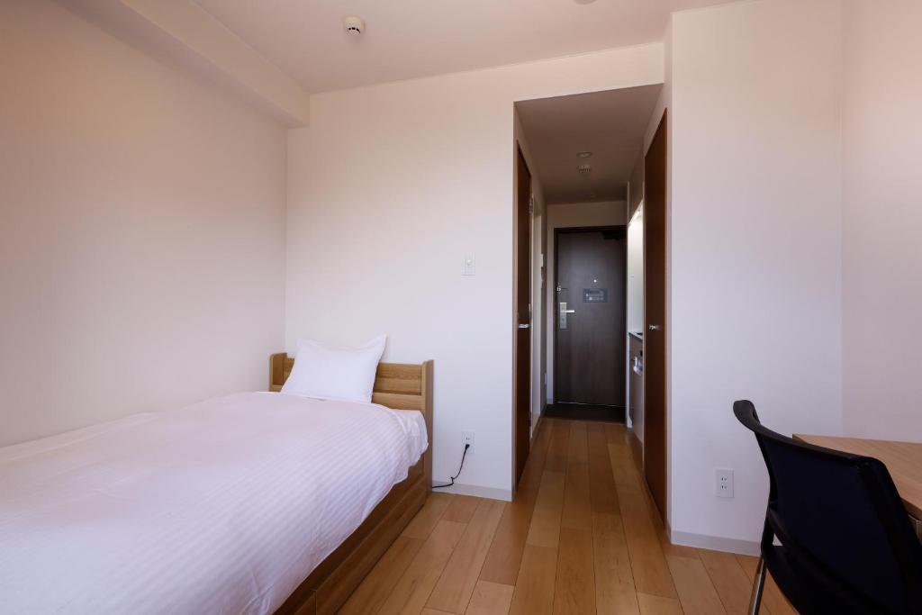 Postel nebo postele na pokoji v ubytování Hotel Nara Sakurai No Sato