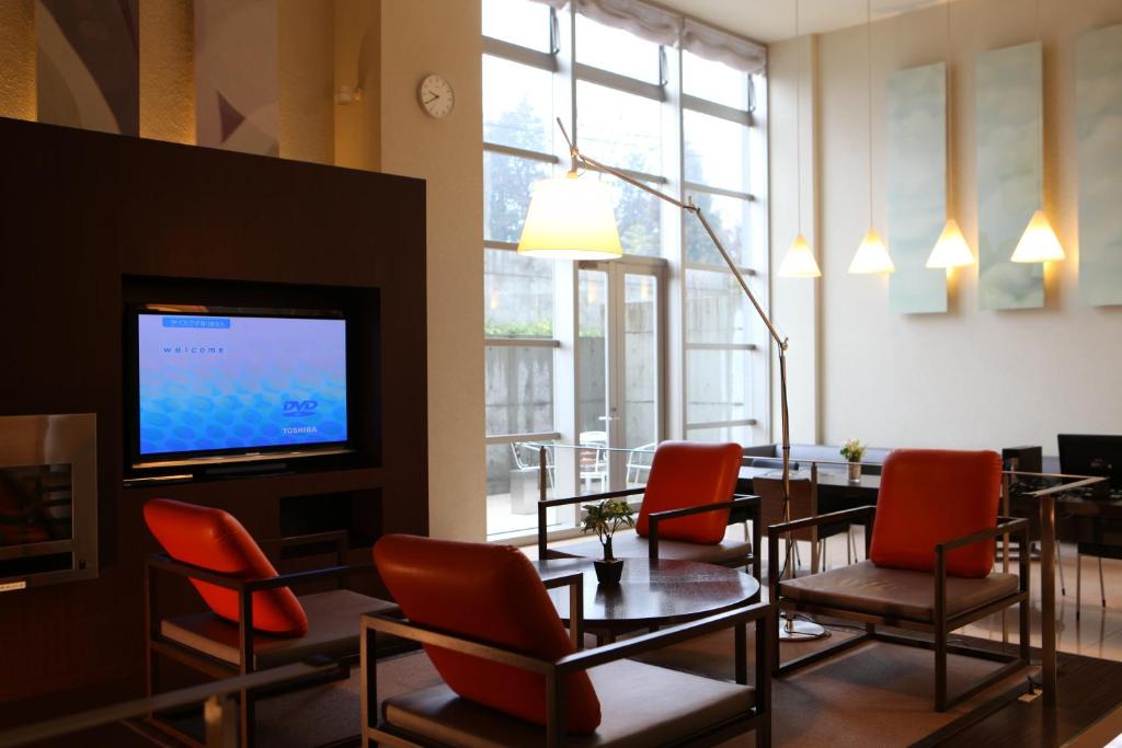 TV a/nebo společenská místnost v ubytování KOKO HOTEL Numazu Inter