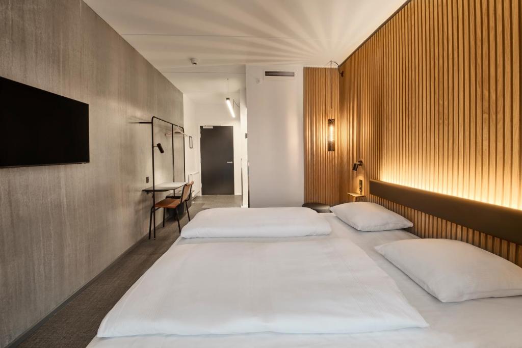 Ένα ή περισσότερα κρεβάτια σε δωμάτιο στο Zleep Hotel Vejle