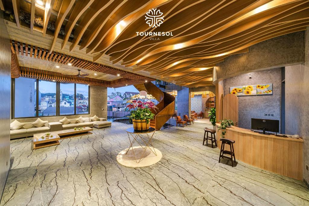 a lobby of a hotel with a reception desk at Tournesol Villa Dalat in Xuan An