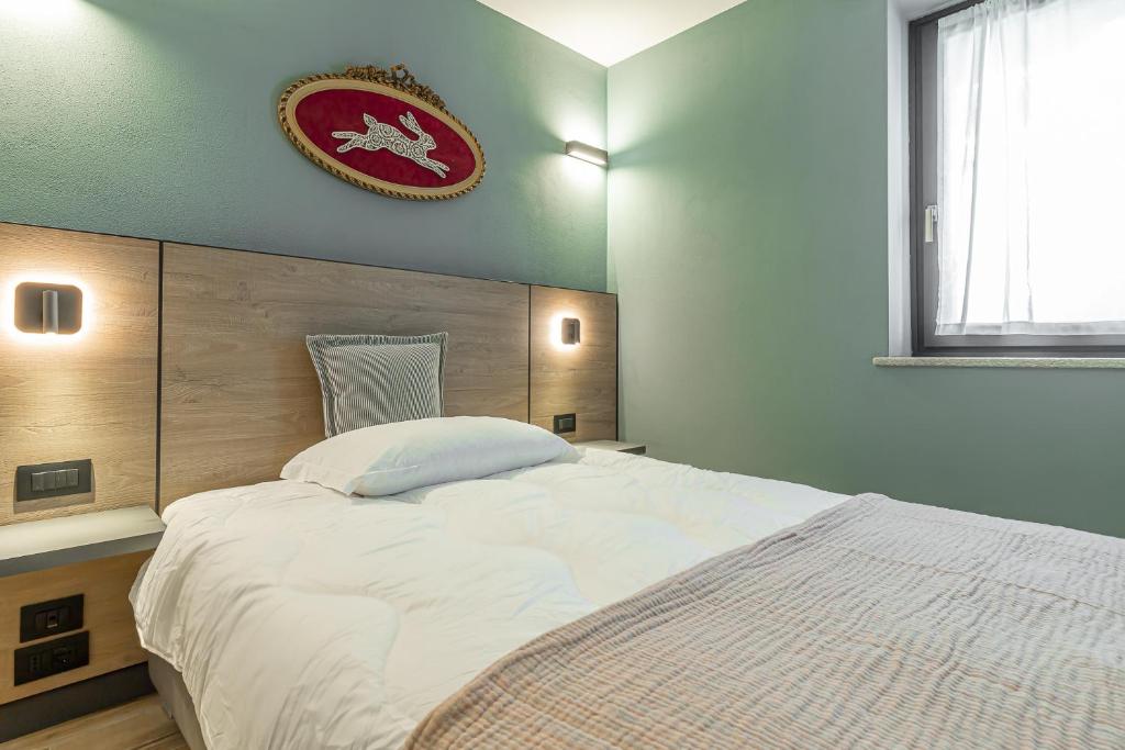 Postel nebo postele na pokoji v ubytování Hotel Mon Émile